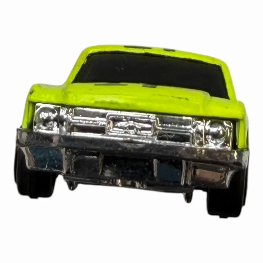 Vintage Yellow Diecast Toy Car with Racing Decals‎